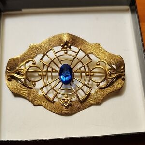 Antique-Style Gold Tone Brooch with Blue Center Stone